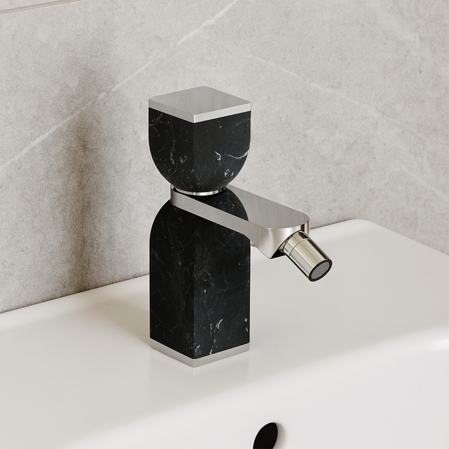 Modern black marble faucet on a white sink with gray tiled wall background