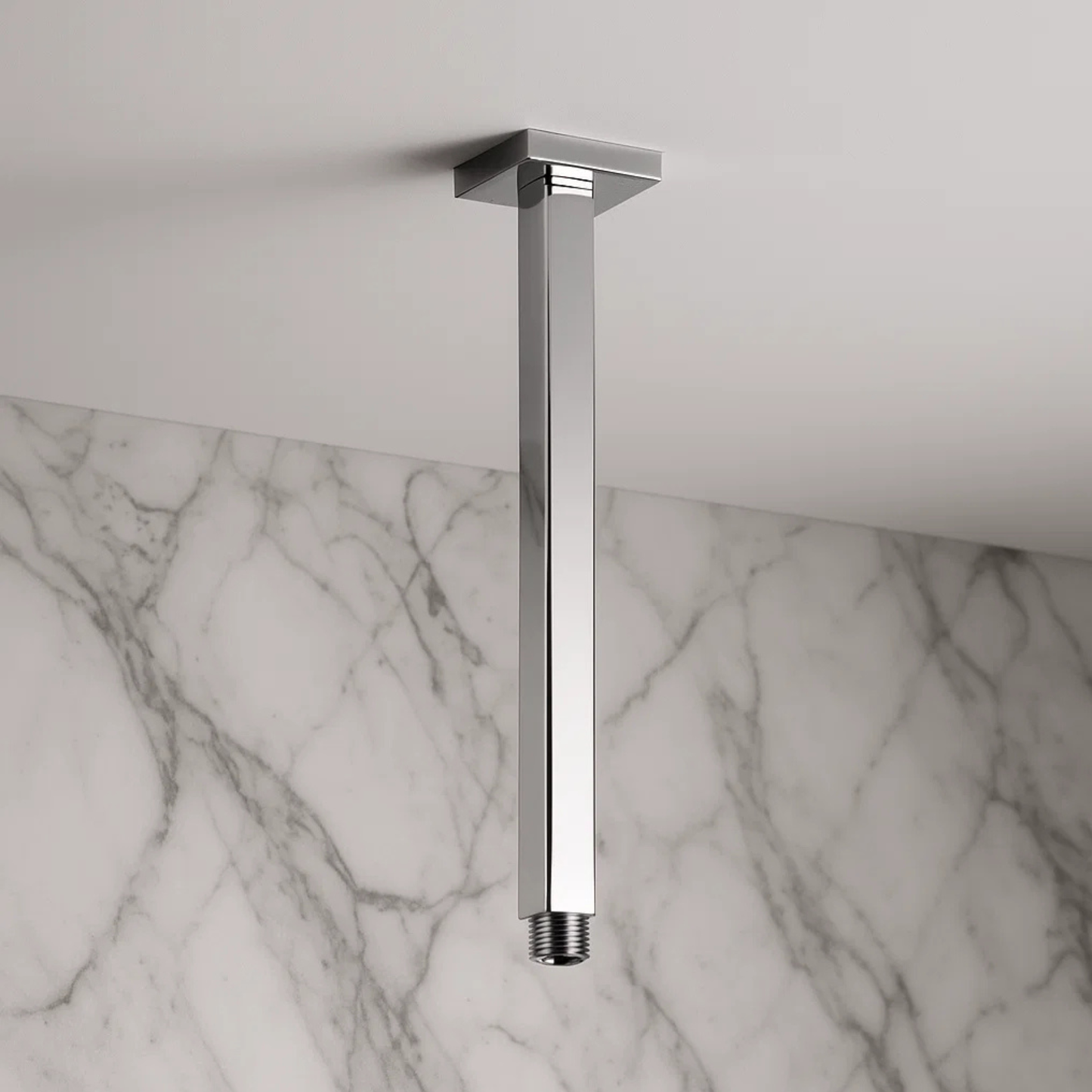 Chrome ceiling-mounted shower head on a marble wall background