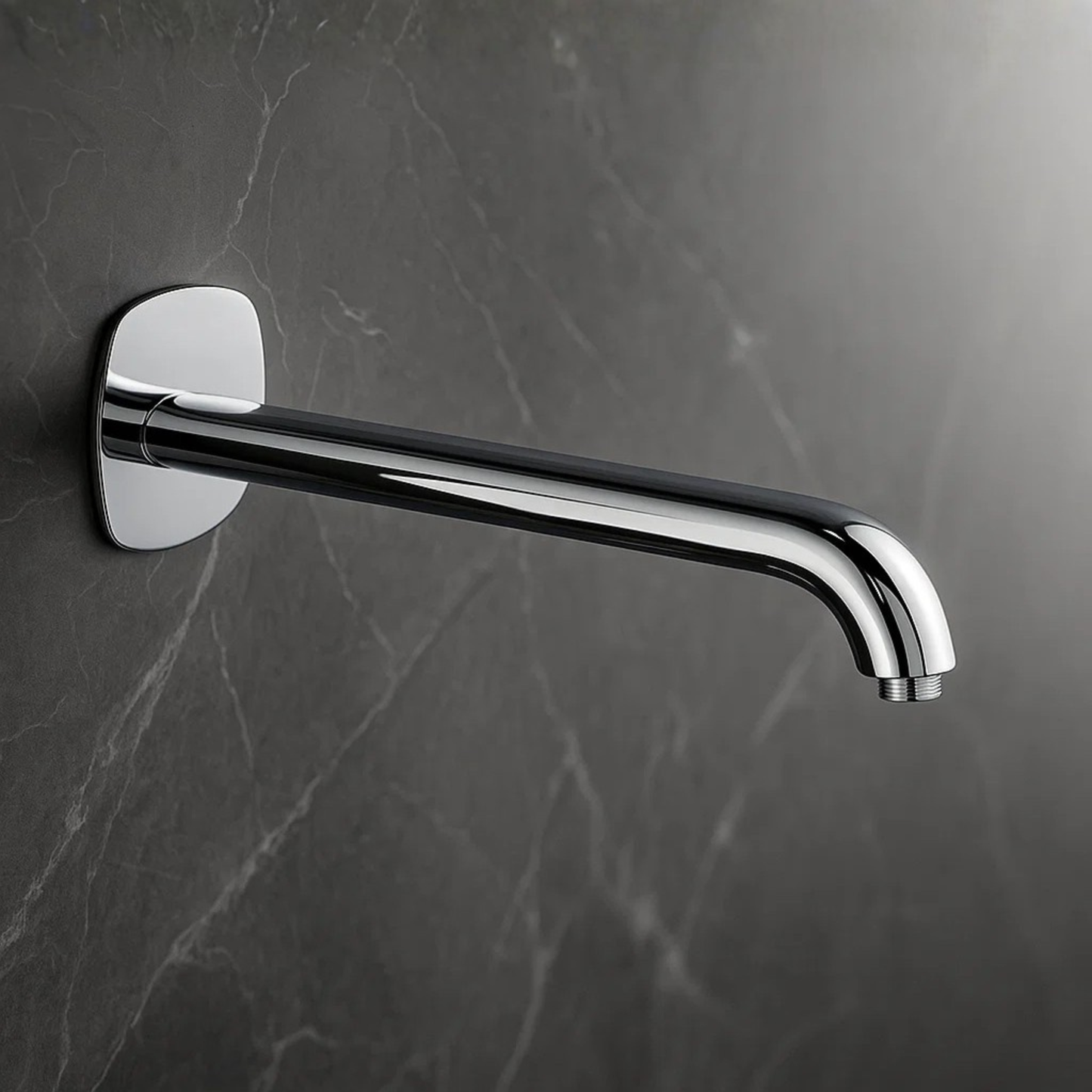Chrome wall-mounted faucet on a dark marble wall