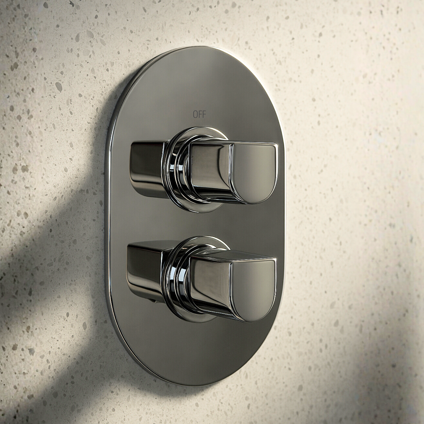 Chrome shower control panel on a textured wall