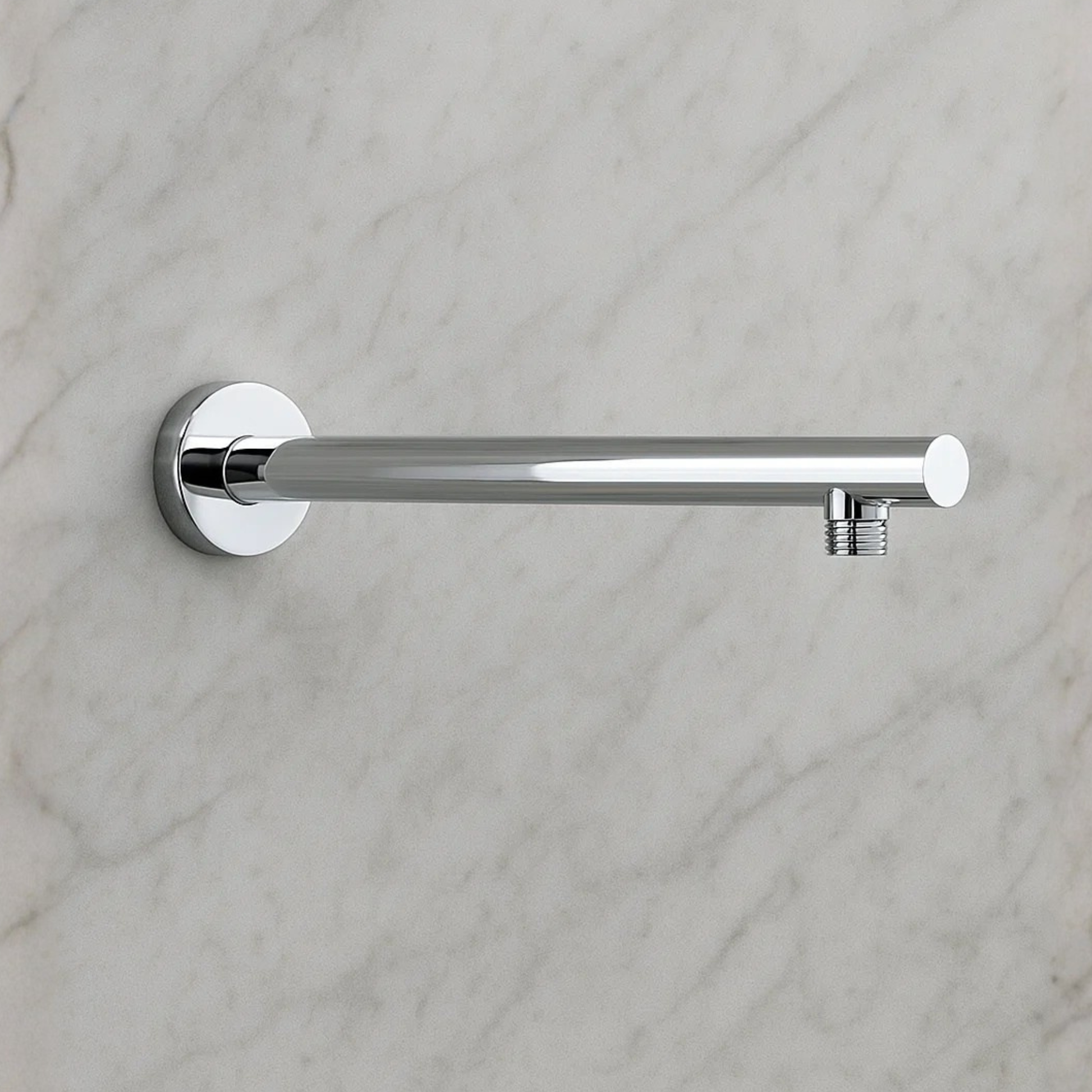 Chrome towel bar mounted on a marble wall