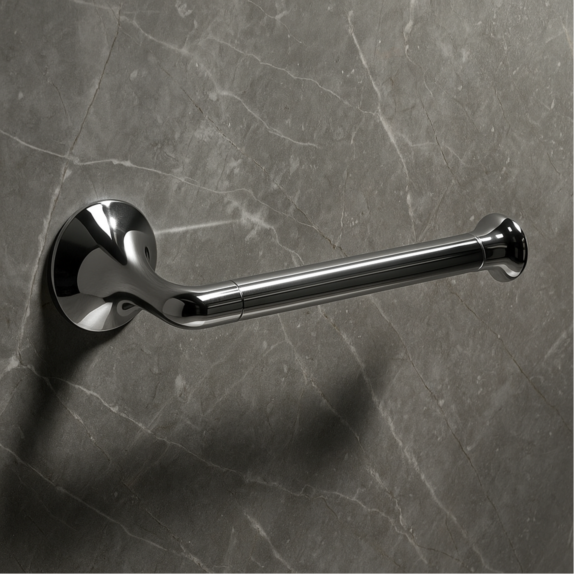 Chrome toilet handle on a gray marble wall