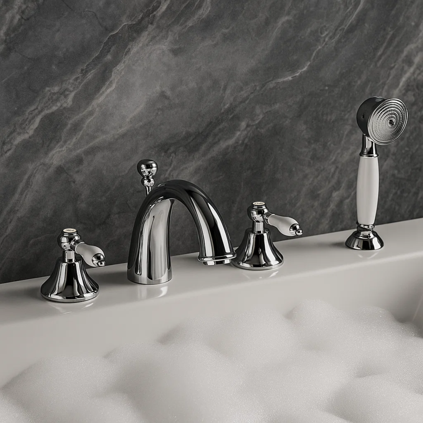 Chrome bathroom faucet set with handheld shower against a marble wall.