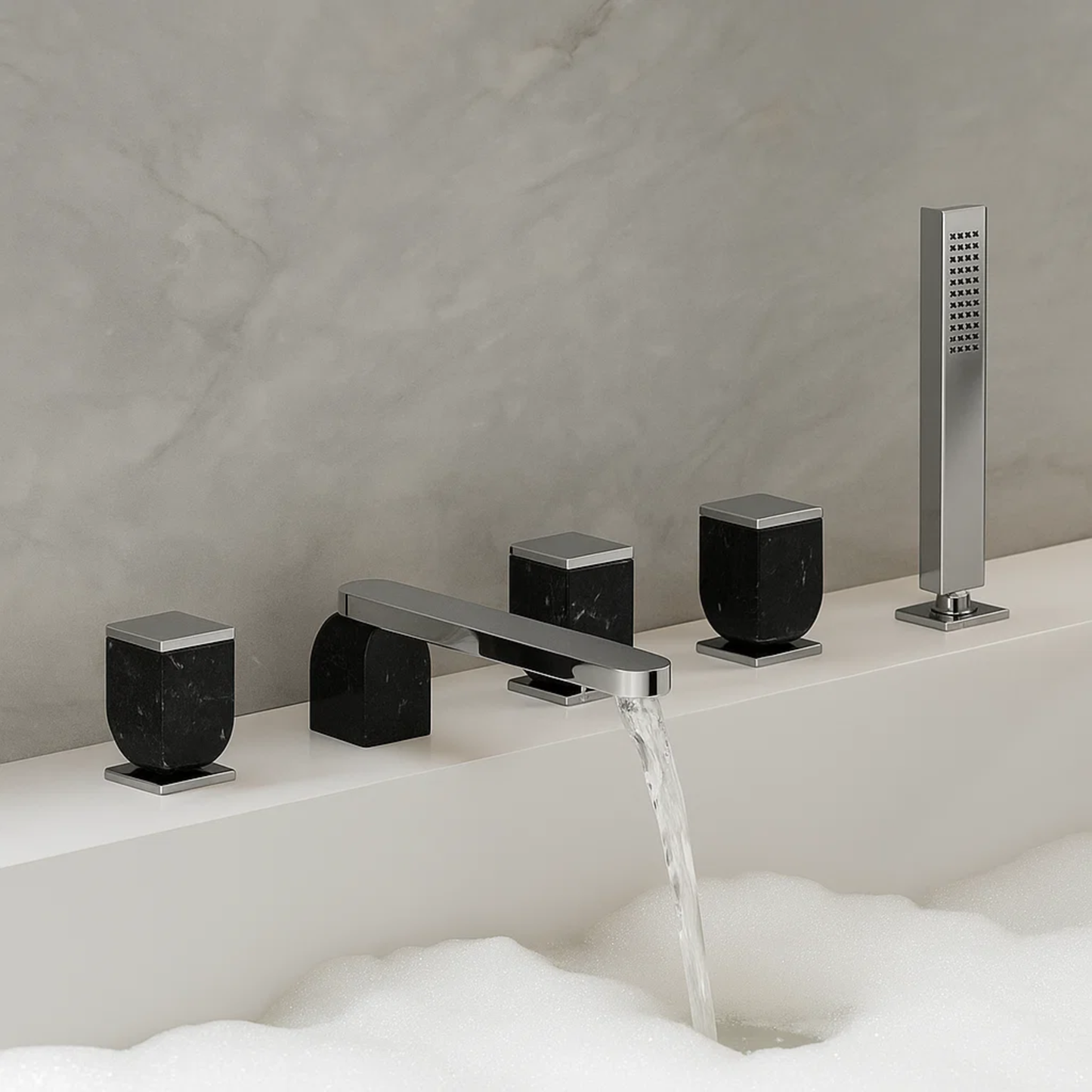 Bathroom faucet set with black and chrome finishes on a bathtub.
