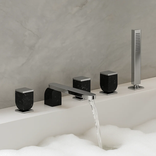 Bathroom faucet set with black and chrome finishes on a bathtub.