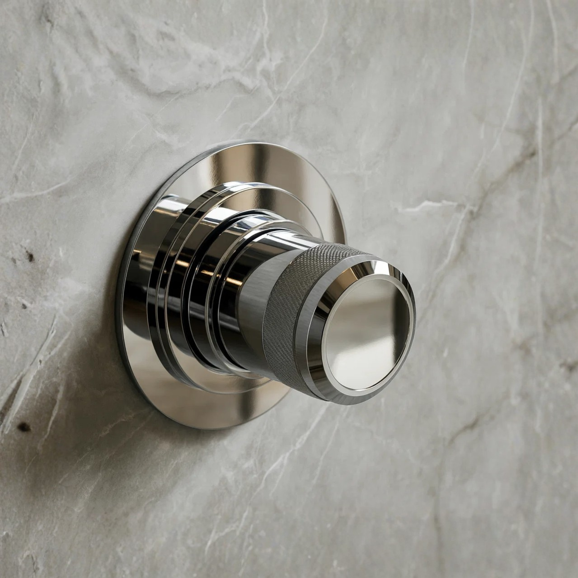 Chrome door handle on a marble wall