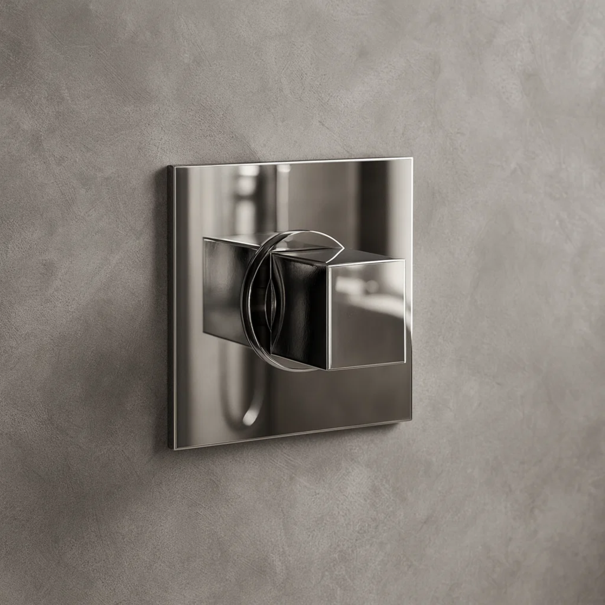 Chrome wall-mounted shower control fixture on a gray concrete wall