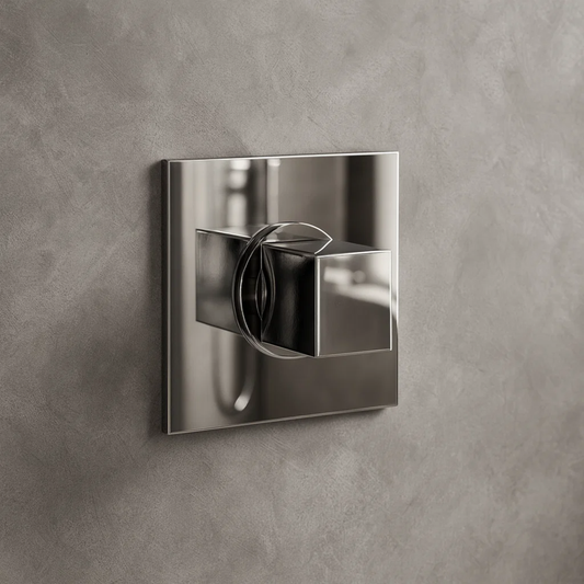 Chrome wall-mounted shower control fixture on a gray concrete wall
