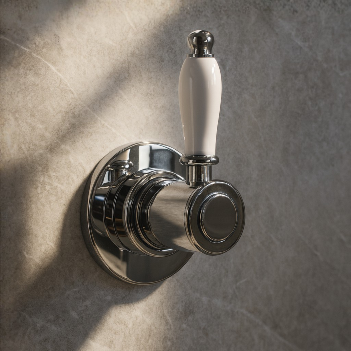 Metallic valve handle with white ceramic knob on a textured wall.