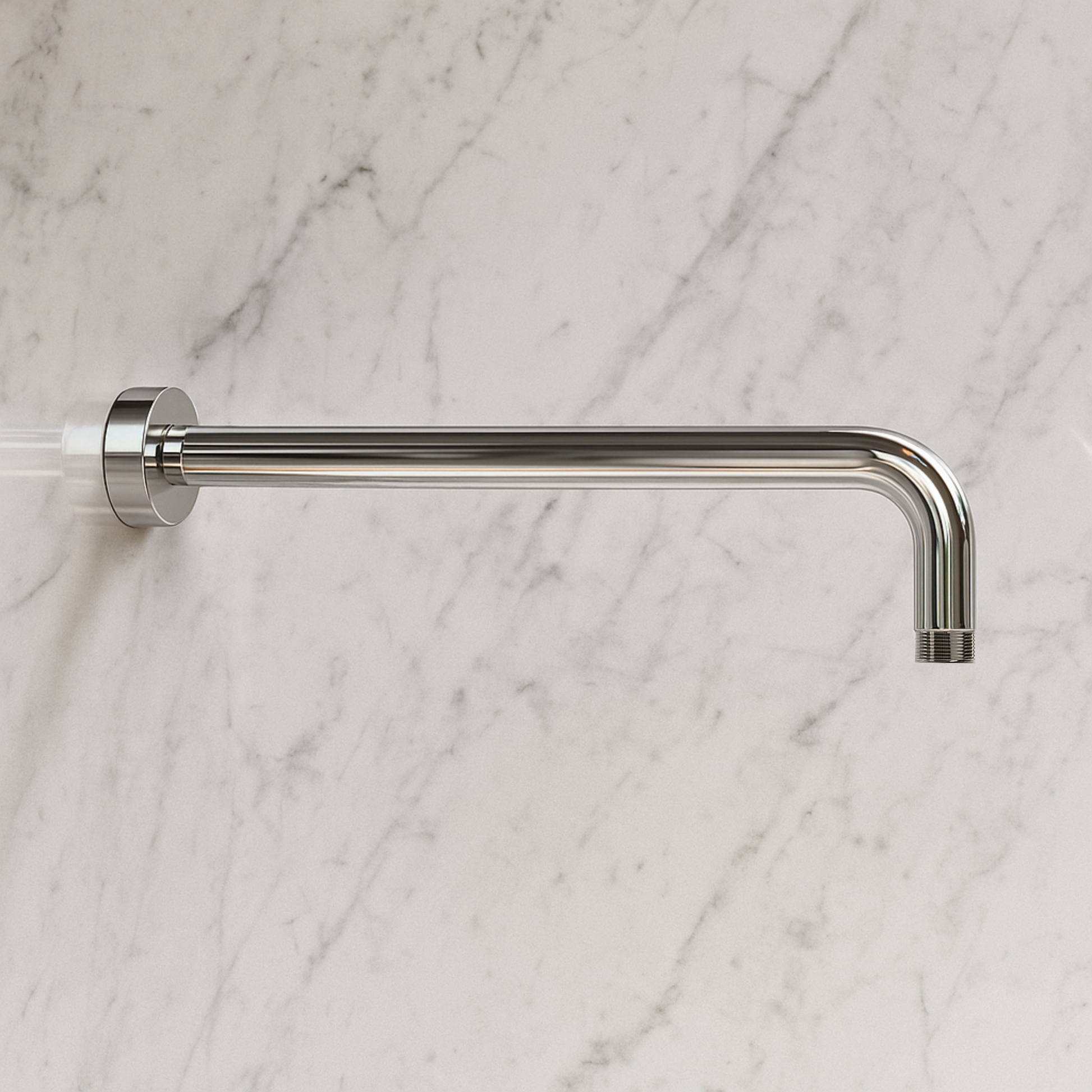Metal shower head on a marble wall