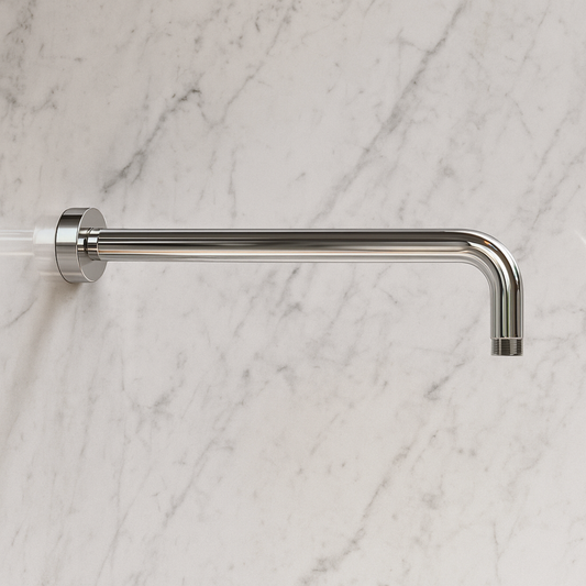 Metal shower head on a marble wall