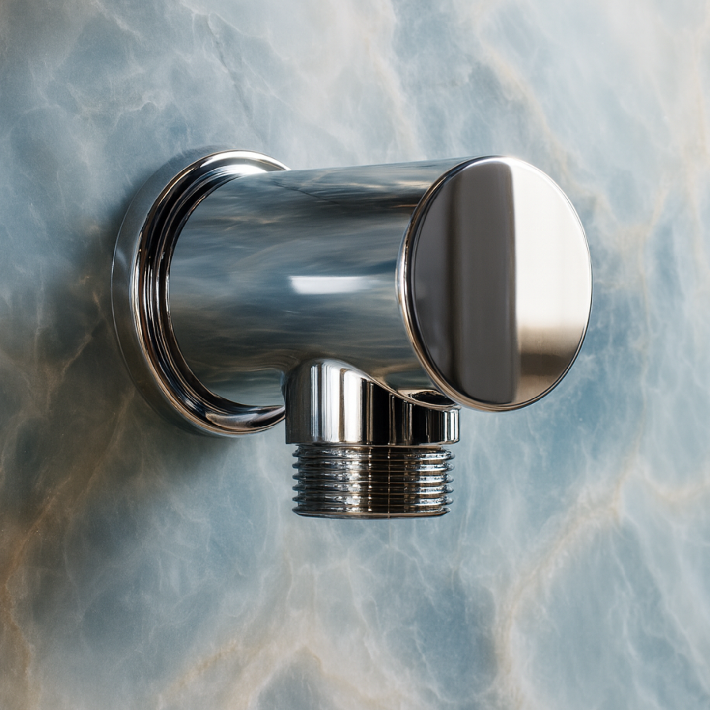Chrome shower valve on a marble wall