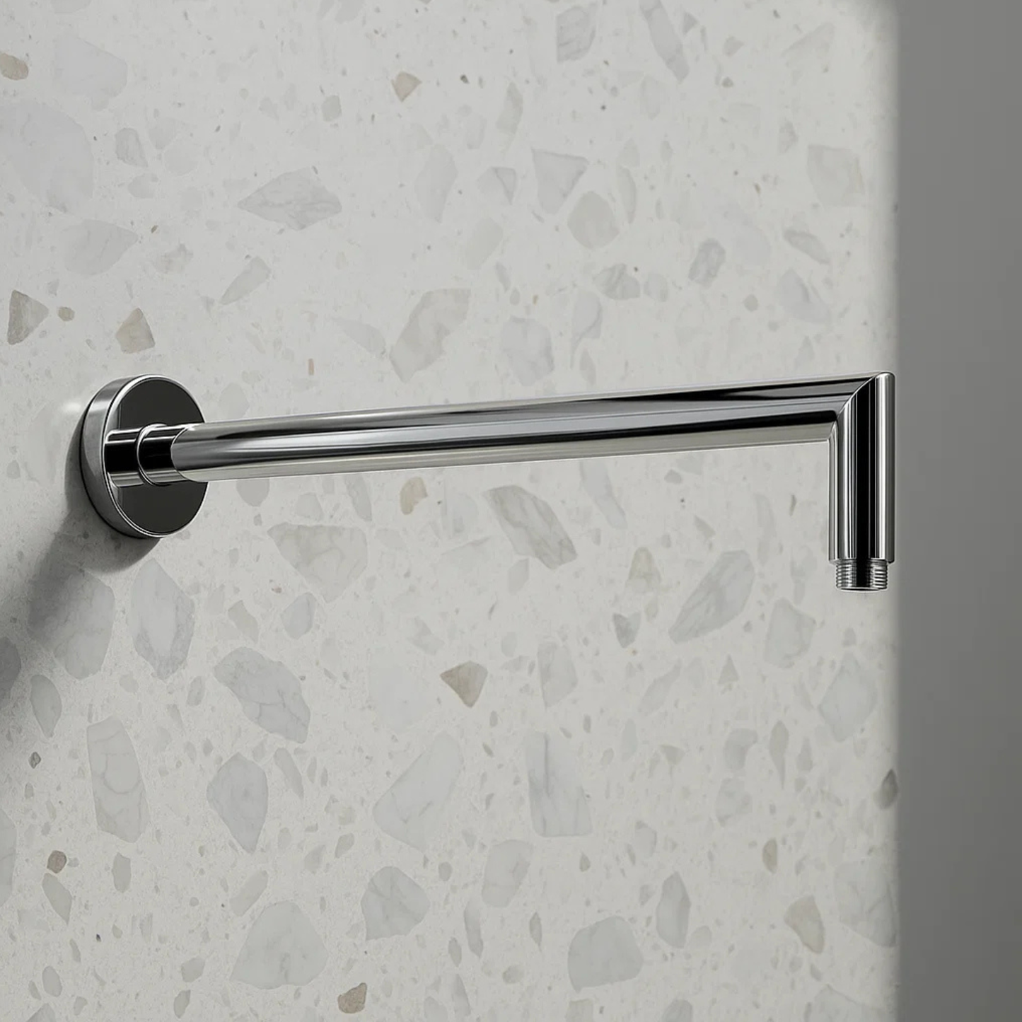 Chrome towel bar mounted on a textured wall