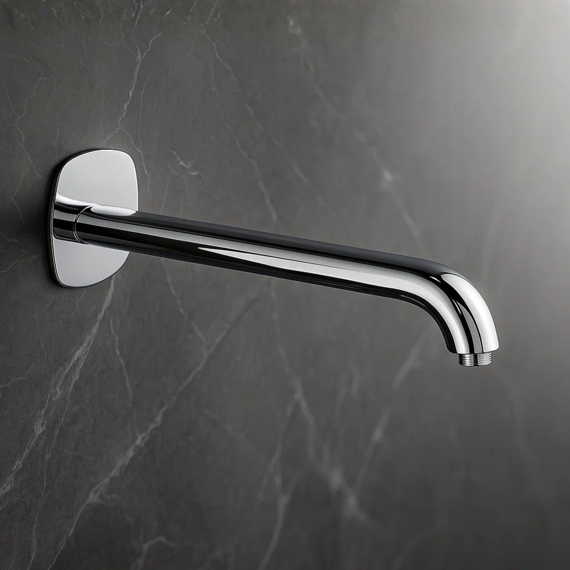 Chrome wall-mounted faucet on a dark marble wall