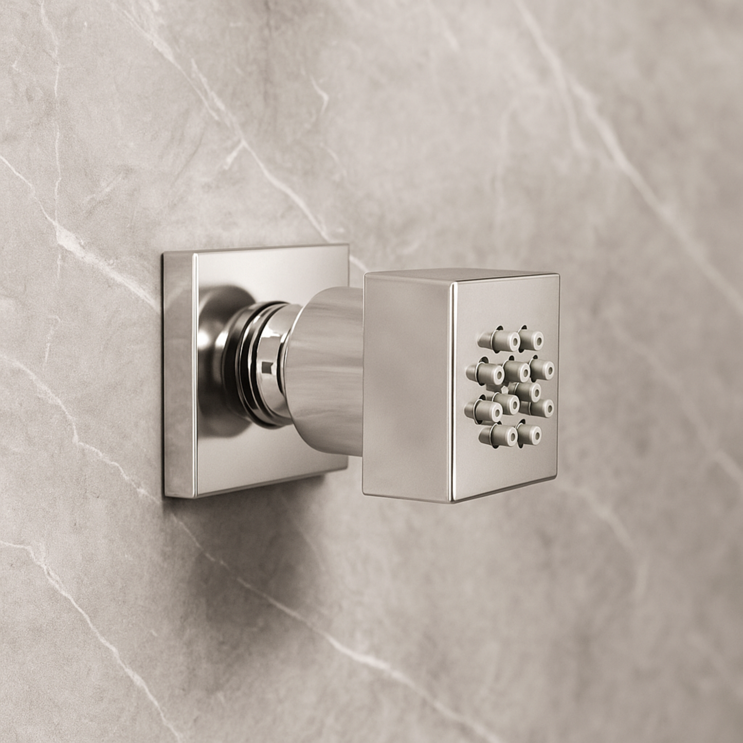Metallic shower control valve on a tiled wall