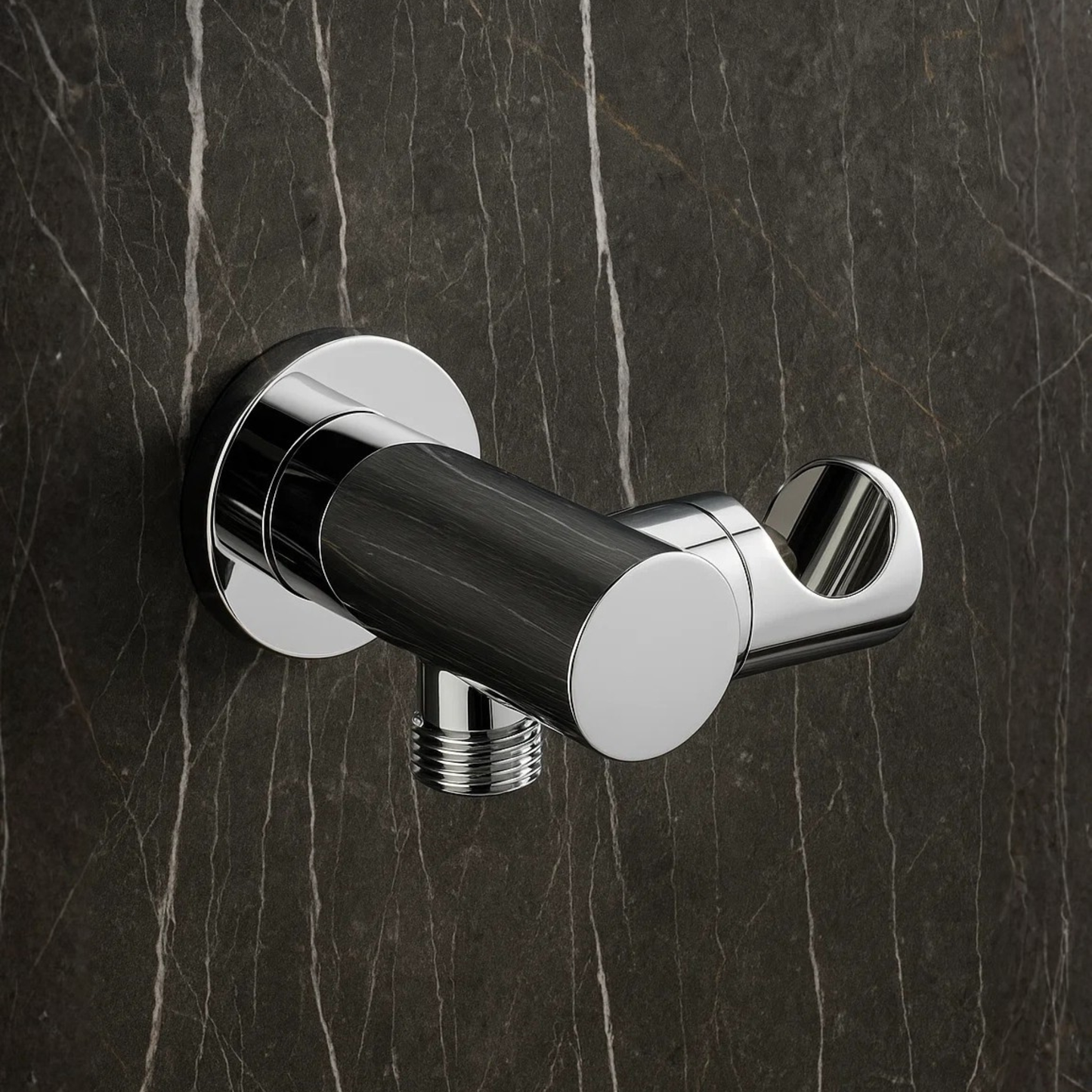 Chrome and black wall-mounted shower valve on a dark marble background