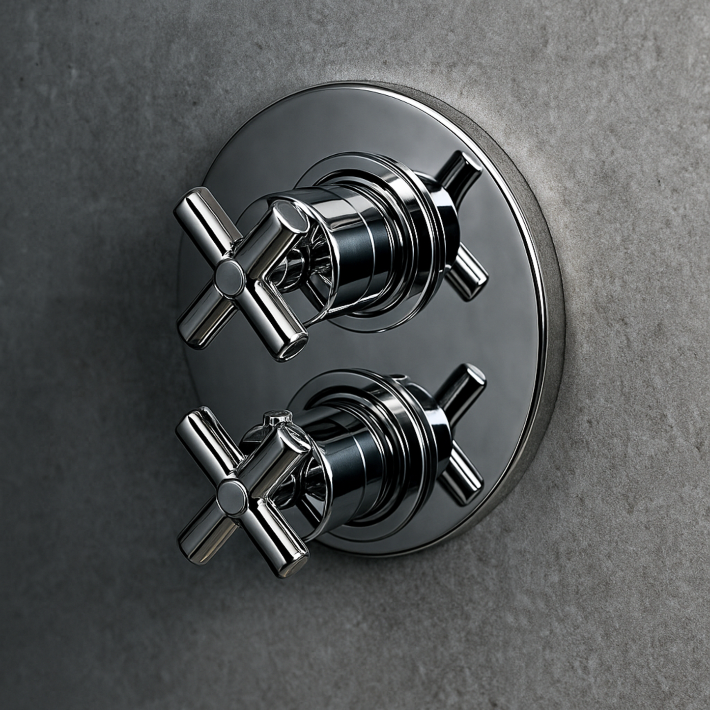 Chrome bathroom valve on a gray wall