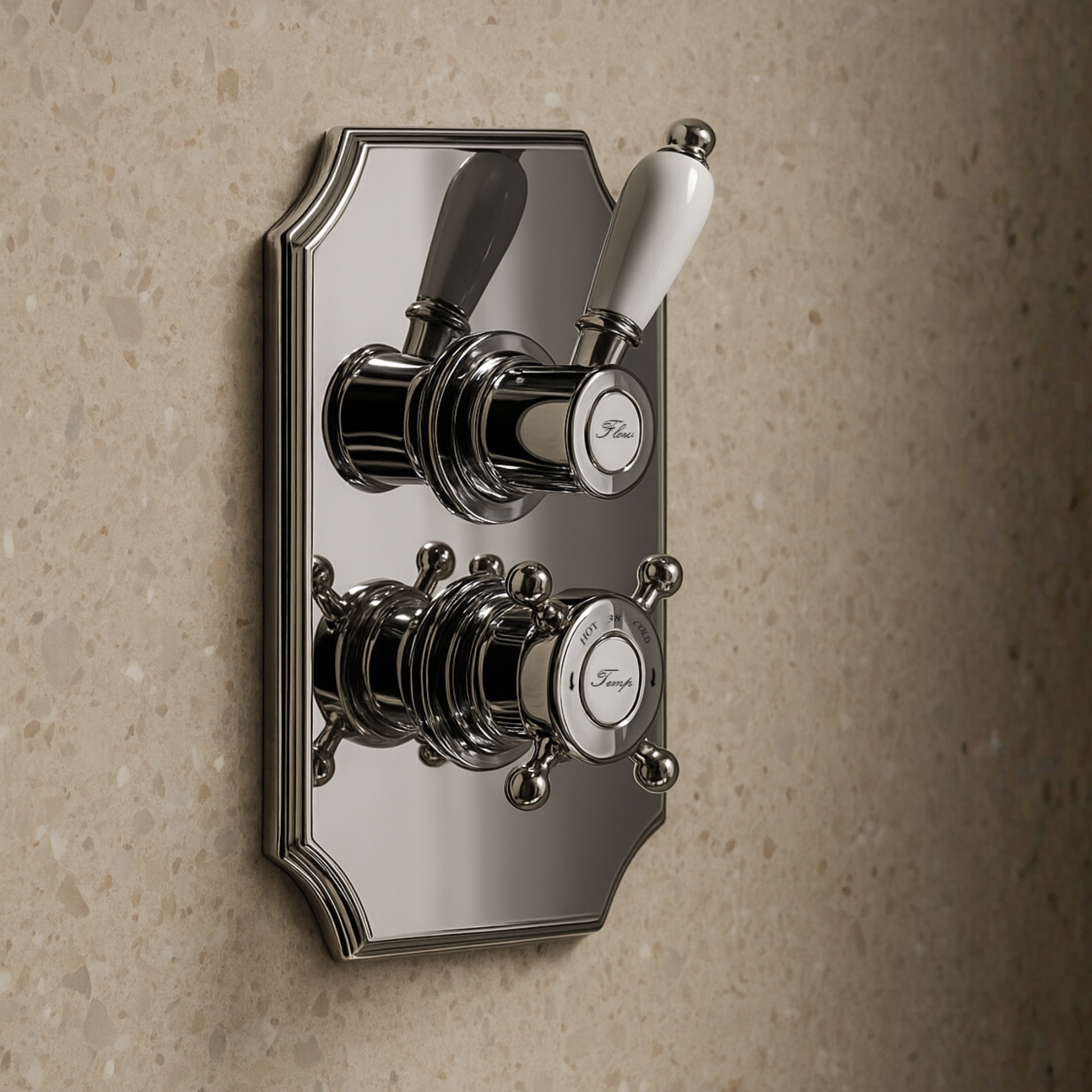 Chrome bathroom valve control with white handle on a beige wall
