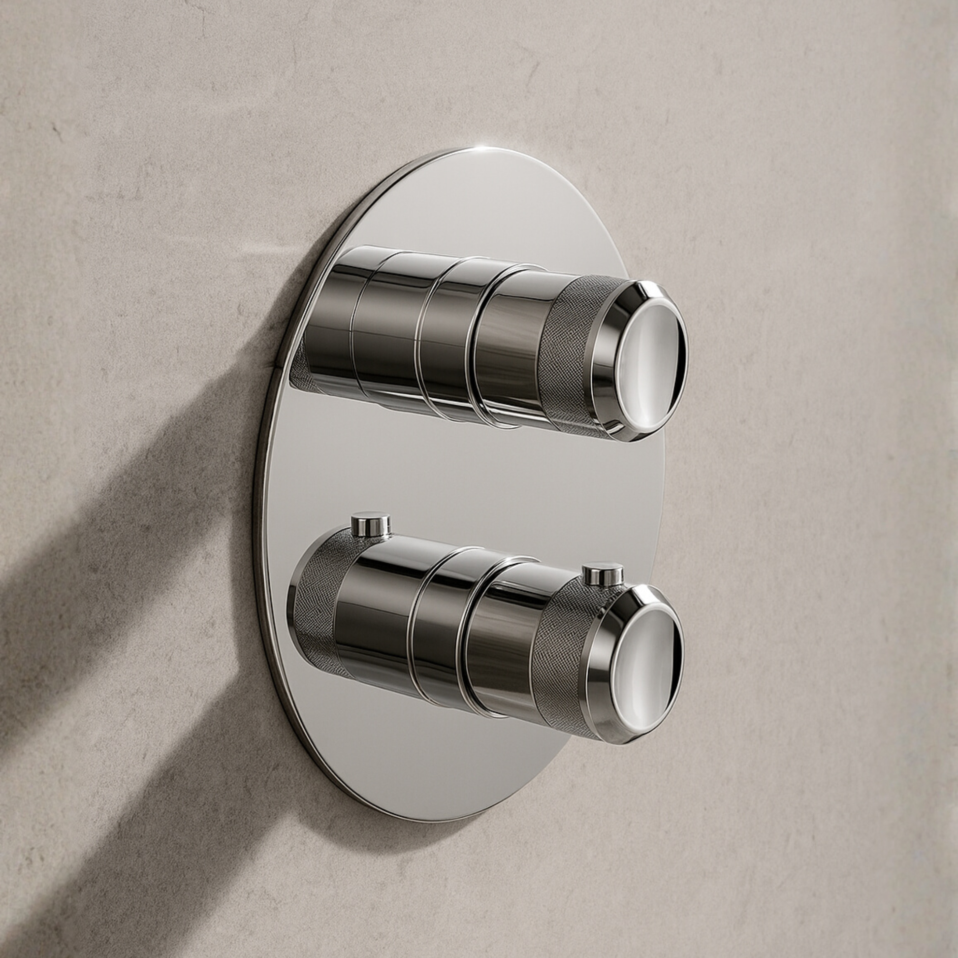 Chrome wall-mounted control valve on a beige wall