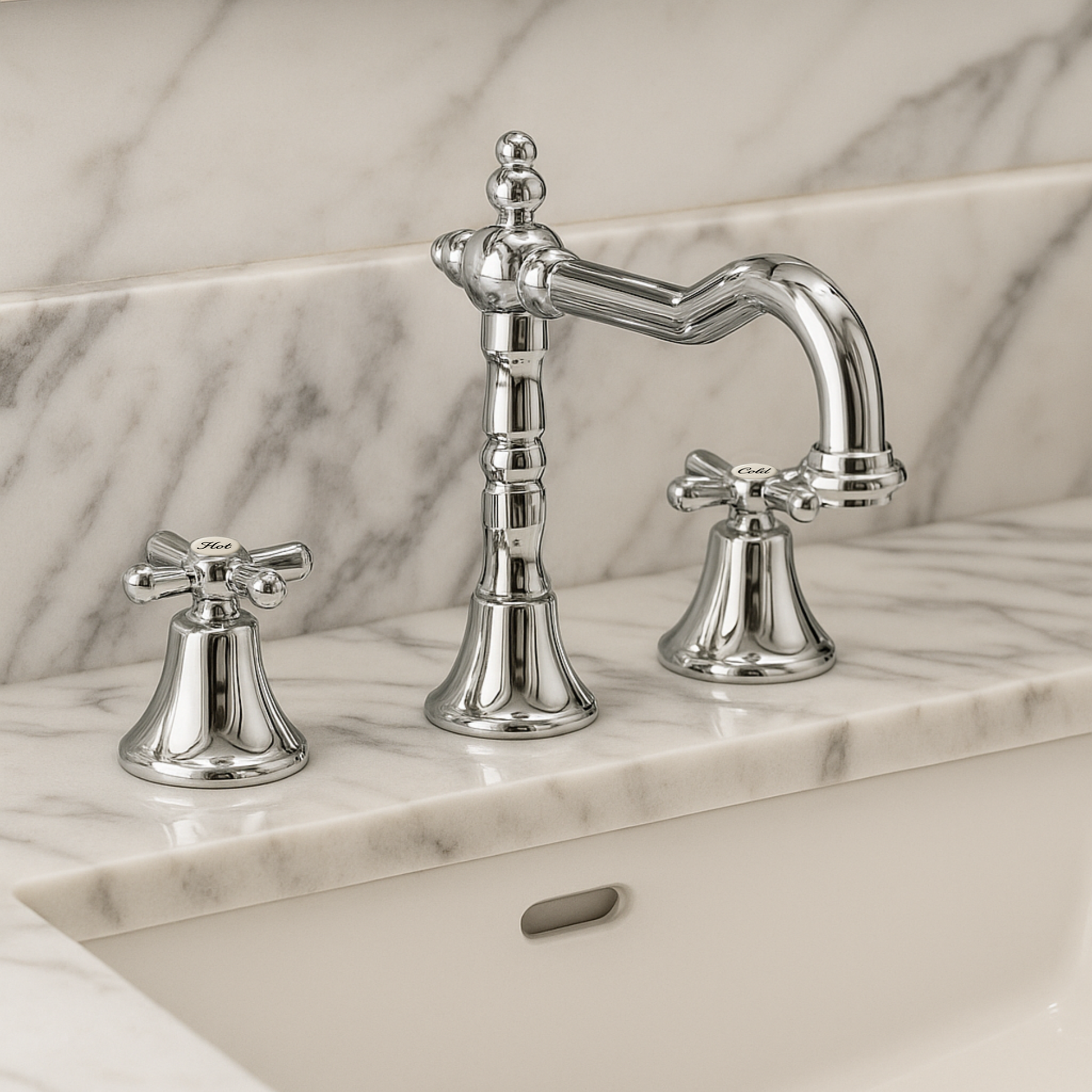 Chrome bathroom faucet set on a marble countertop